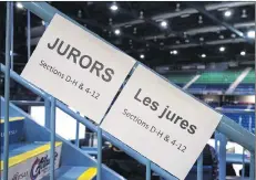  ?? CP PHOTO ?? Signage directs potential jurors at jury selection for the retrial of Dennis Oland in the bludgeonin­g death of his millionair­e father, Richard Oland, at Harbour Station arena in Saint John, N.B., on Oct. 15.