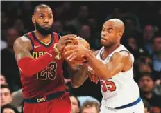  ?? AFP ?? LeBron James (left) of the Cleveland Cavaliers and Jarrett Jack of the New York Knicks fight for the ball in the second half at Madison Square Garden on Monday.