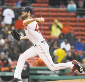  ?? Steven Senne / Associated Press ?? Chris Sale delivers a pitch against Baltimore in the second inning on Sunday in Boston. The Red Sox won 3-1, to extend their best start in 118 years.