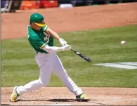  ?? THEARON W. HENDERSON/GETTY IMAGES/TNS ?? The A's Matt Chapman hits an RBI double against the Angels on Monday at RingCentra­l Coliseum in Oakland.