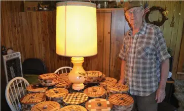  ?? (Special to The Commercial/Richard Ledbetter) ?? J.D. Harris, 91, stands next to several of his handmade decorative bowls.