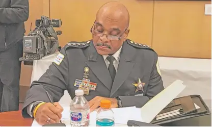  ??  ?? Chicago Police Supt. Eddie Johnson prepares for his testimony Thursday at a City Council budget hearing. | FRAN SPIELMAN/ SUN- TIMES