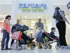  ?? —AP ?? MIAMI: In this Feb 9, 2016 file photo, shoppers are shown in Miami. US consumer spending rose at only a sluggish pace in January 2017.