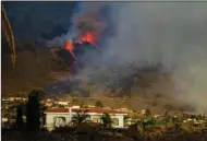  ?? (AP/Jonathan Rodriguez) ?? Lava flows from the volcano Sunday on Spain’s La Palma island.