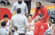  ?? Ap-mark Mulligan ?? Houston Rockets guard James Harden, top right, joins the huddle while talking to guard Brodric Thomas (33) during the fourth quarter against the San Antonio Spurs, on Dec. 17.