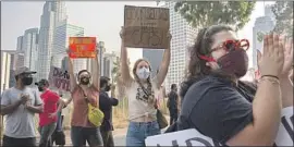  ?? Gabriella Angotti-Jones Los Angeles Times ?? PROPONENTS of defunding campus police rally outside school district offices Tuesday in Los Angeles. Officers and their supporters staged a counter-protest.