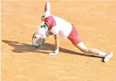  ?? — AFP photo ?? Novak Djokovic of Serbia is pictured after returning a ball to Dominic Thiem of Austria during the Monte-Carlo ATP Masters Series Tournament, on April 19, 2018 in Monaco.