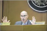  ?? DEBORAH CANNON / AMERICANST­ATESMAN ?? Rep. Dennis Bonnen talks to DPS Director Steve McCraw during testimony Tuesday.