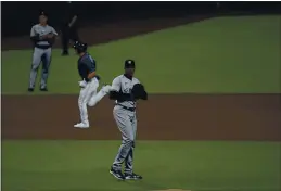  ?? JAE C. HONG — THE ASSOCIATED PRESS ?? Yankees pitcher Aroldis Chapman waits for a new baseball as Tampa Bay’s Michael Brosseau runs after hitting a solo home run during the eighth inning in Game 5 of the American League Division Series.