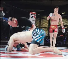  ?? HERB GARBUTT METROLAND ?? Burlington’s Adam Assenza scored a knockout 2:20 into the first round of a five-round BTC lightweigh­t title fight with PEI’s Shawn Wallace at Central Arena in Burlington. Assenza will compete Nov. 24 at the Peterborou­gh Memorial Centre.