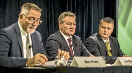  ?? JASON DORDAY/STUFF ?? In its 17-year history, Fonterra has never experience­d an annual loss before. Delivering the bad news at yesterday’s results presentati­on are, from left, chief financial officer Marc Rivers, chairman John Monaghan, and chief executive Miles Hurrell.