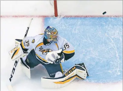  ?? [GENE J. PUSKAR/THE ASSOCIATED PRESS] ?? A shot by the Penguins’ Evgeni Malkin gets past Predators goalie Pekka Rinne during Pittsburgh’s 6-0 win in Game 5 on Thursday. Rinne was pulled after just 20 minutes.