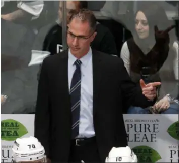  ?? DAVID ZALUBOWSKI — THE ASSOCIATED PRESS FILE ?? Kings coach John Stevens watches his team during the third period of a game against the Avalanche in Denver. Stevens has been fired by the struggling Kings just 13 games into his second season in charge.