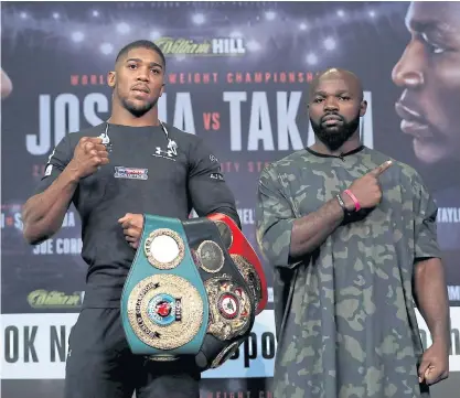  ??  ?? Anthony Joshua, left, and Carlos Takam pose during a press conference ahead of today’s fight in Cardiff.