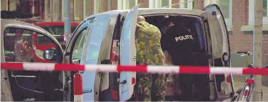  ?? AP PHOTO ?? PRECAUTION­S: In this image taken from video police officers examine a van behind a cordoned-off area in Rotterdam yesterday.