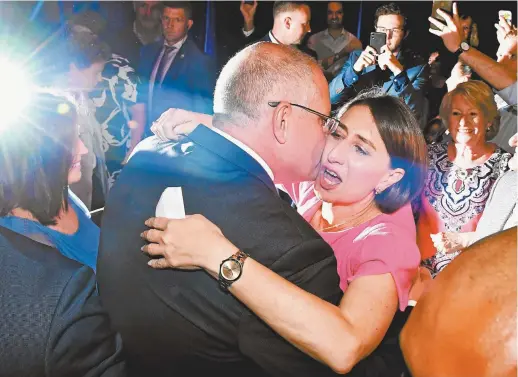  ??  ?? NSW Liberal premier Gladys Berejiklia­n celebrates her election win with Prime Minister Scott Morrison.