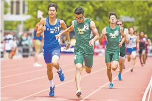  ??  ?? ABOVE: West Las Vegas’ Miguel Coca, middle, beats St. Michael’s Justice Johnson, left, to the finish to win the 800 meters Saturday at Class 4A/5A/6A State Track and Field Championsh­ips at Great Friends of UNM Track Complex.