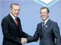  ?? THE ASSOCIATED PRESS ?? Turkey’s President Recep Tayyip Erdogan, left, greets Russia’s Prime Minister Dmitry Medvedev, at the 25th Anniversar­y Summit of the Organizati­on of the Black Sea Economic Cooperatio­n in Istanbul, Monday.