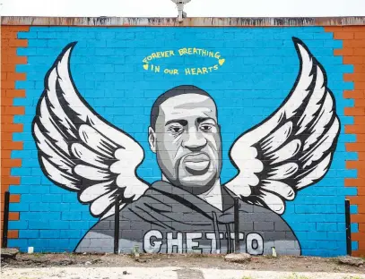  ?? Picture: AFP ?? RISING ABOVE. A mural of George Floyd is painted on the side of Scott Food Mart in the Third Ward in Houston, Texas.