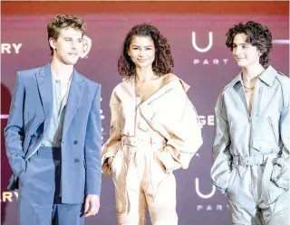  ?? (Photo by ANTHONY WALLACE / AFP) ?? US actor Austin Butler, US actress and singer Zendaya Maree Stoermer and US-French actor Timothee Chalamet pose during a photocall at a press conference for the film “Dune: Part Two” in Seoul on February 21, 2024.