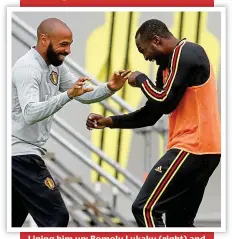  ?? AP ?? Lining him up: Romelu Lukaku (right) and Henry lark about in training