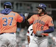  ?? Nam Y. Huh / Associated Press ?? Astros coach Alex Cintron welcomes the K-prone Jake Marisnick to first base in the seventh inning.