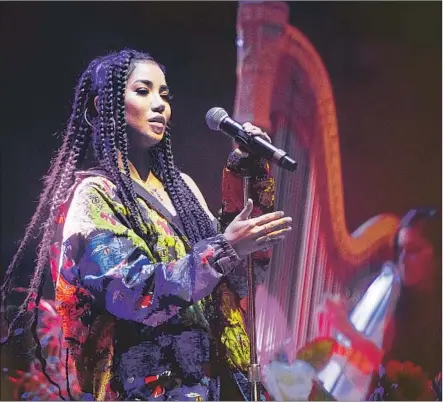  ?? Photograph­s by Michael Owen Baker For The Times ?? R&amp;B SINGER Jhené Aiko performs at the All My Friends music festival on Saturday. Tips for healthy living were included.