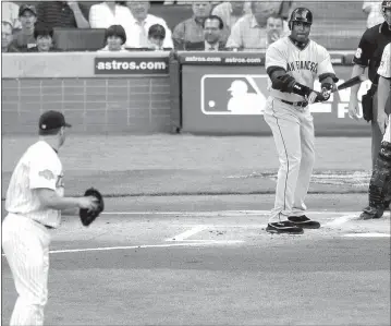  ?? THE ASSOCIATED PRESS — 2004 ?? Pitcher Roger Clemens faces off against Barry Bonds. Neither is expected to make the Hall of Fame cut.