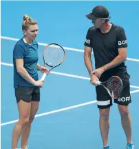  ?? Getty Images ?? Simona Halep listens to coach Darren Cahill during a practice session ahead of the 2018 Australian Open. —