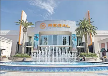  ?? Gina Ferazzi Los Angeles Times ?? THE 21-SCREEN Regal Irvine Spectrum underwent renovation­s during its pandemic shutdown. It reopened to a radically changed world as new films faced backlogs and many cinephiles opted to stream movies at home.