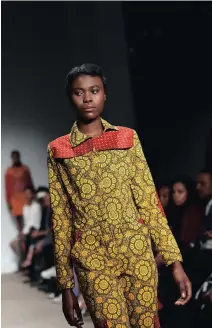  ??  ?? COLOURFUL COMBOS: Creations from the Siyathokoz­a collection at SA Fashion Week.