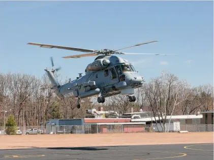  ?? File Kaman press photo via Business Wire ?? A pilot hovers a Super Seasprite helicopter in 2014 at Kaman’s headquarte­rs facility in Bloomfield, Connecticu­t.