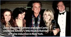  ??  ?? June, Rosanne, Carlene and John Carter celebrate Johnny’s 1992 Rock & Roll Hall
of Fame induction in New York.