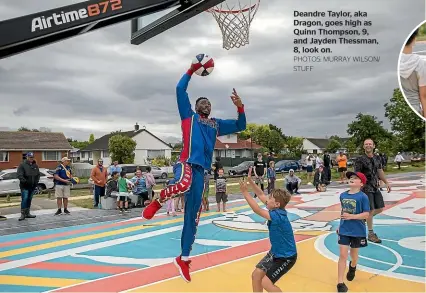  ?? PHOTOS: MURRAY WILSON/ STUFF ?? Deandre Taylor, aka Dragon, goes high as Quinn Thompson, 9, and Jayden Thessman, 8, look on.