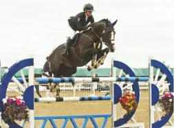  ??  ?? “He’s a legend and doesn’t let me down” – 17-year-old Van De Vivaldi wins the 1.40m grand prix – and a tidy £2,000 – for Yazmin Pinchen