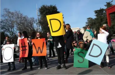  ??  ?? PARTICIPAN­TS hold placards during a flashmob event on World Down Syndrome Day in front of the United Nations in Geneva, Switzerlan­d. | REUTERS/Denis Balibouse