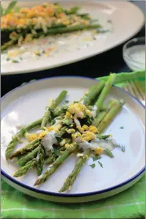  ?? GRETCHEN MCKAY — PITTSBURGH POST-GAZETTE ?? A simple asparagus salad with grated egg and yogurt sauce is an elegant side dish.