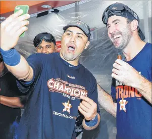  ?? AP PHOTO ?? In this Sept. 17, 2017, file photo, Houston Astros’ Carlos Beltran, left, and Justin Verlander celebrate the team’s win over the Seattle Mariners to clinch the AL West crown in Houston.