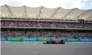  ?? Photograph: Darron Cummings/Reuters ?? Max Verstappen races past grandstand­s containing plenty of his orange-clad supporters.