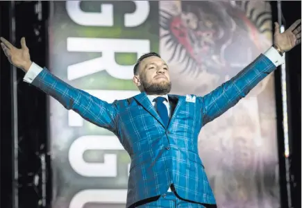  ?? Christophe­r Katsarov ?? The Associated Press UFC fighter Conor Mcgregor gestures to the crowd during a promotiona­l stop with Floyd Mayweather Jr. in Toronto on Wednesday for their Aug. 26 boxing match at T-mobile Arena. Early wagering on the fight is siding heavily with...