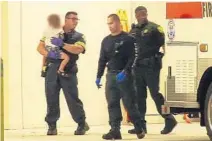  ?? JIM DONNELLY/COURTESY ?? Broward Sheriff Rescue firefighte­r Justin Mezzacappa carries a toddler boy who was rescued from a car about 1 a.m. Monday in Deerfield Beach.