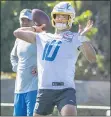  ?? MARK RIGHTMIRE — STAFF PHOTOGRAPH­ER ?? Chargers quarterbac­k Justin Herbert, coming off a stellar rookie season, throws a pass as training camp begins.