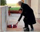  ?? AP ?? Emmanuel Macron and Theresa May lay a wreath at the Thiepval Memorial in France.