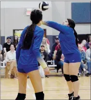  ?? Westside Eagle Observer/MIKE ECKELS ?? Lady Bulldog Anette Hernandez (right) uses a forearm hit to send the ball back over the net into Lady Warrior territory during the Life Way-Decatur volleyball contest in Centerton Friday night.
