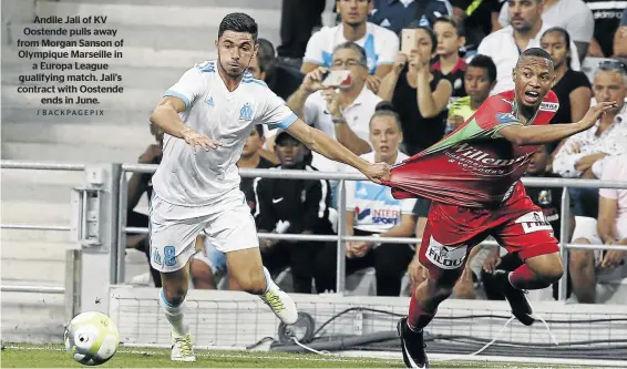  ?? / BACKPAGEPI­X ?? Andile Jali of KV Oostende pulls away from Morgan Sanson of Olympique Marseille in a Europa League qualifying match. Jali’s contract with Oostende ends in June.