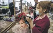  ?? ?? KATHERINE CRUZ, 19, takes a cosmetolog­y course at Profession­al Institute of Beauty on Main Street.