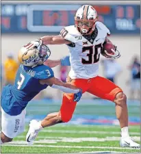  ??  ?? Oklahoma State's Chuba Hubbard (30) leads the nation in rushing with 521 yards through three games. [SARAH PHIPPS/THE OKLAHOMAN]