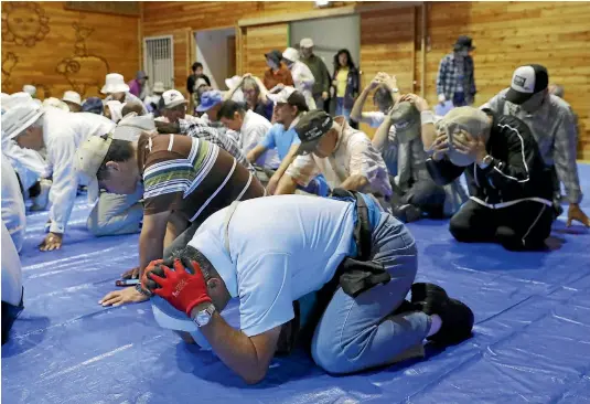  ?? REUTERS ?? Residents of Takikawa, on Japan’s northernmo­st main island of Hokkaido, take part in an emergency drill yesterday in the wake of repeated missile launches by North Korea.