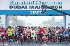  ?? Ahmed Ramzan/ Gulf News ?? A huge group of runners begin at the start of the Standard Chatered Dubai Marathon at Umm Suqeim street in Dubai.