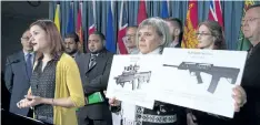  ?? ADRIAN WYLD/ THE CANADIAN PRESS ?? Dawson College shooting survivor Meaghan Hennigan speaks as her mother, Kathleen Dixon, holds up images of assault rifles during a news conference in Ottawa last week.